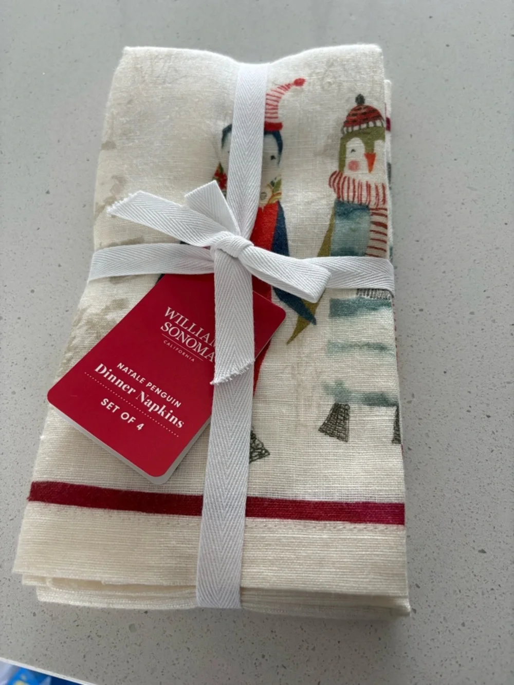 Williams Sonoma Cream Holiday Penguin Dinner Napkins with Red Trim - Set of 4